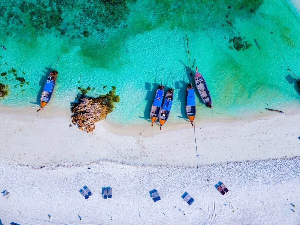 overhead shot of boats on the beach - Koh Lipe Thailand